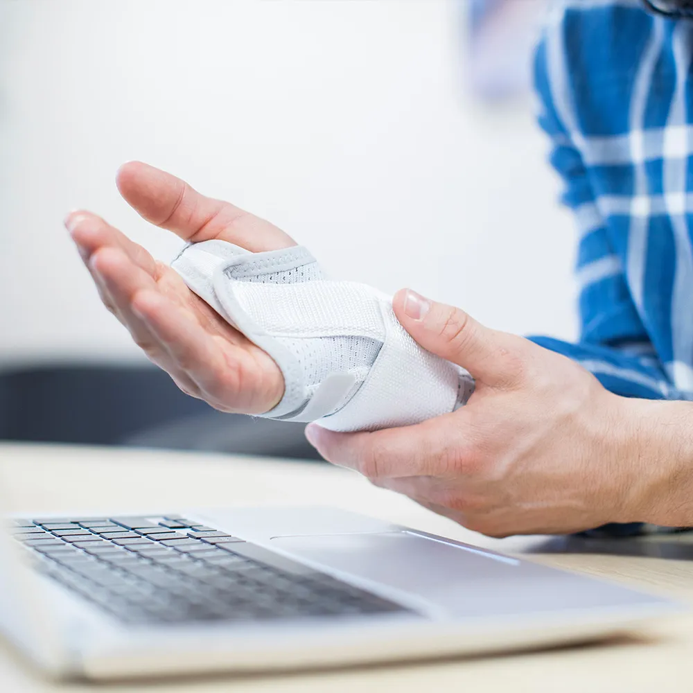 Person wearing a wrist brace for carpal tunnel.