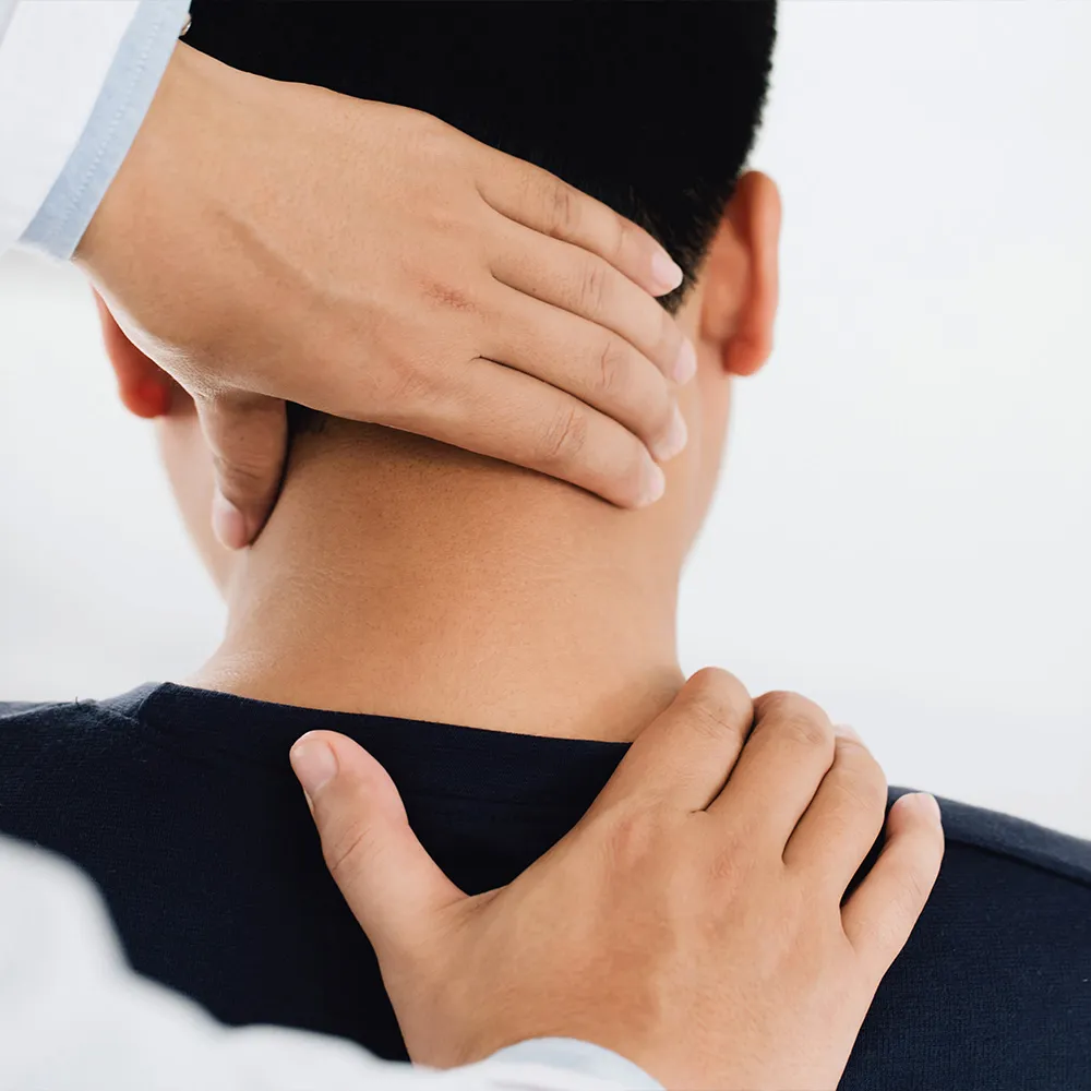 Hands holding man’s head and neck.