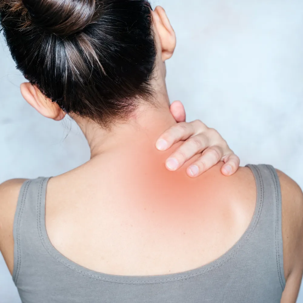 Woman holding neck in pain  