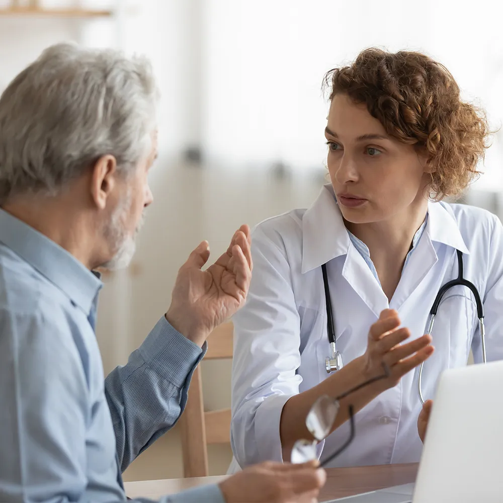 Doctor talking with men patient