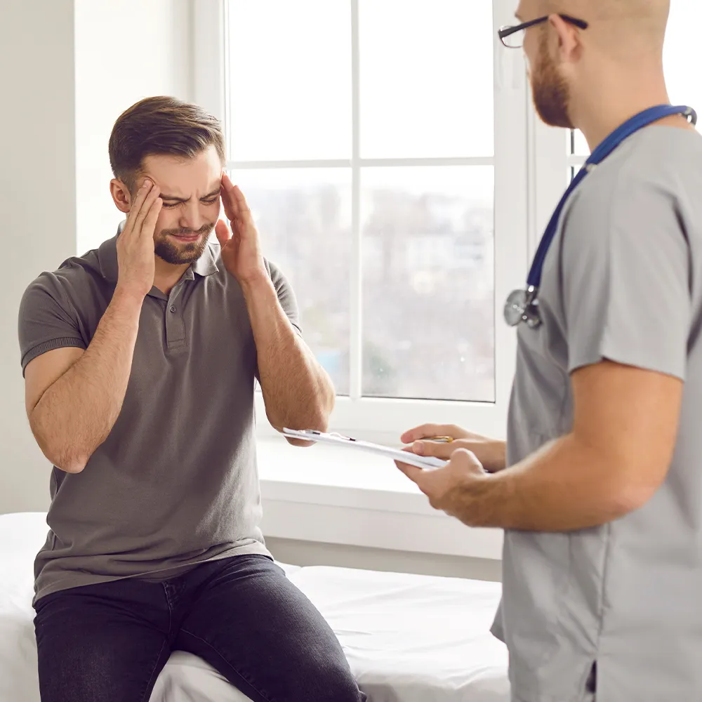 Men with migraines at the doctor