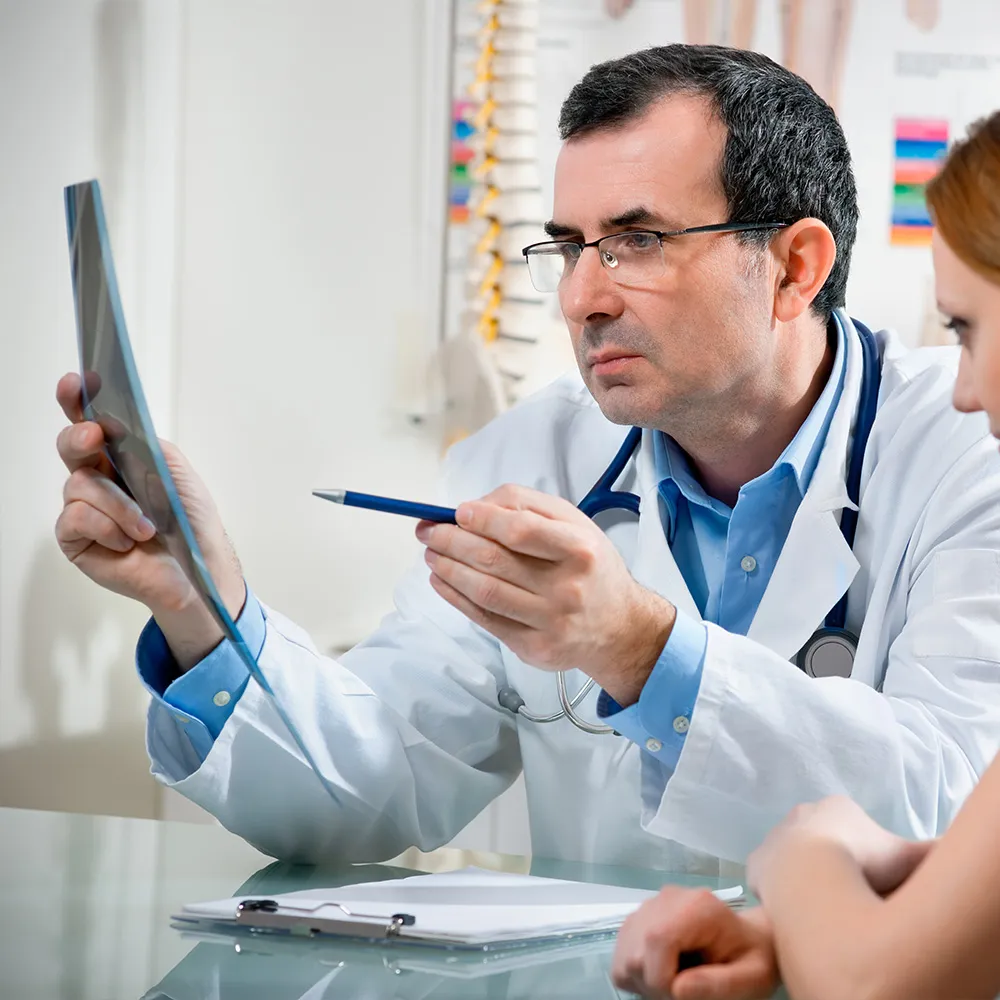 Doctor viewing x-rays