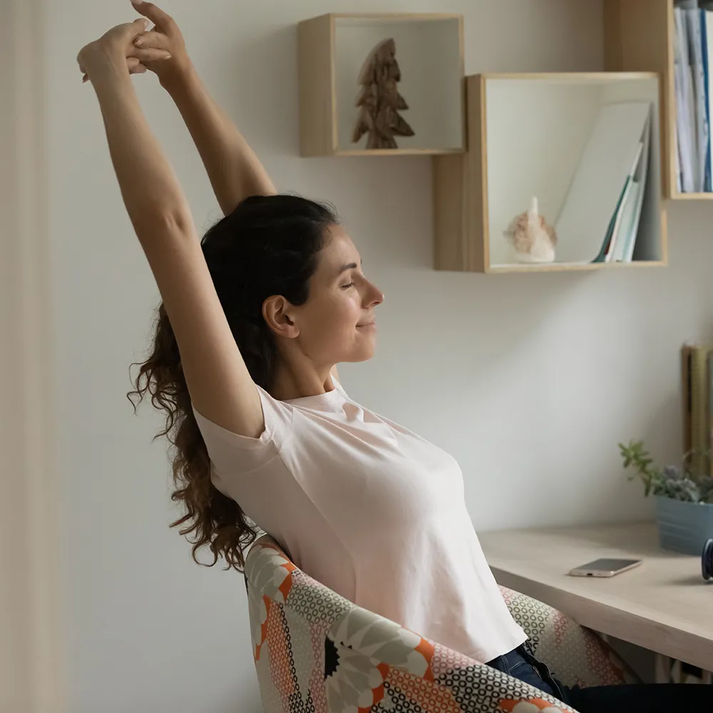 Happy woman feeling relief from back pain.