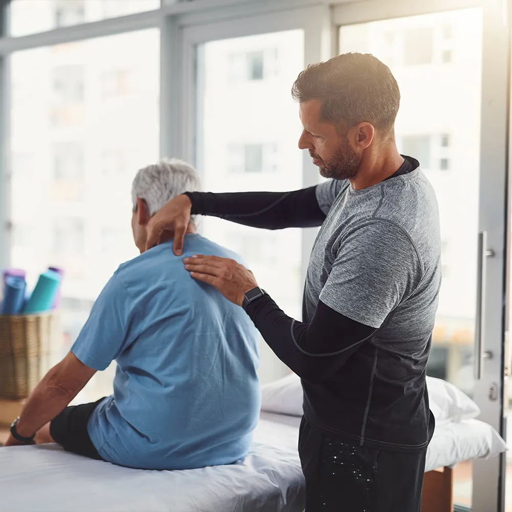 Doctor examining patient in clinic  