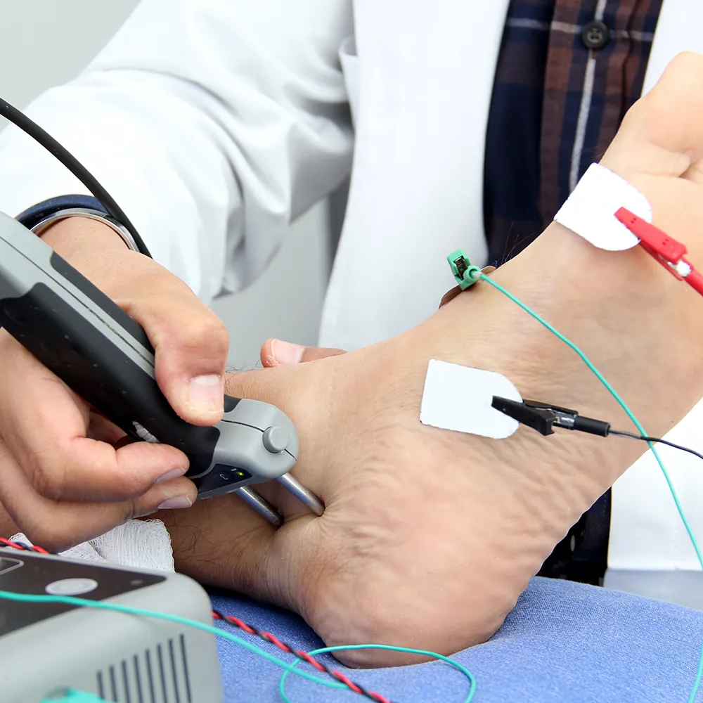Doctor performing nerve conduction test  