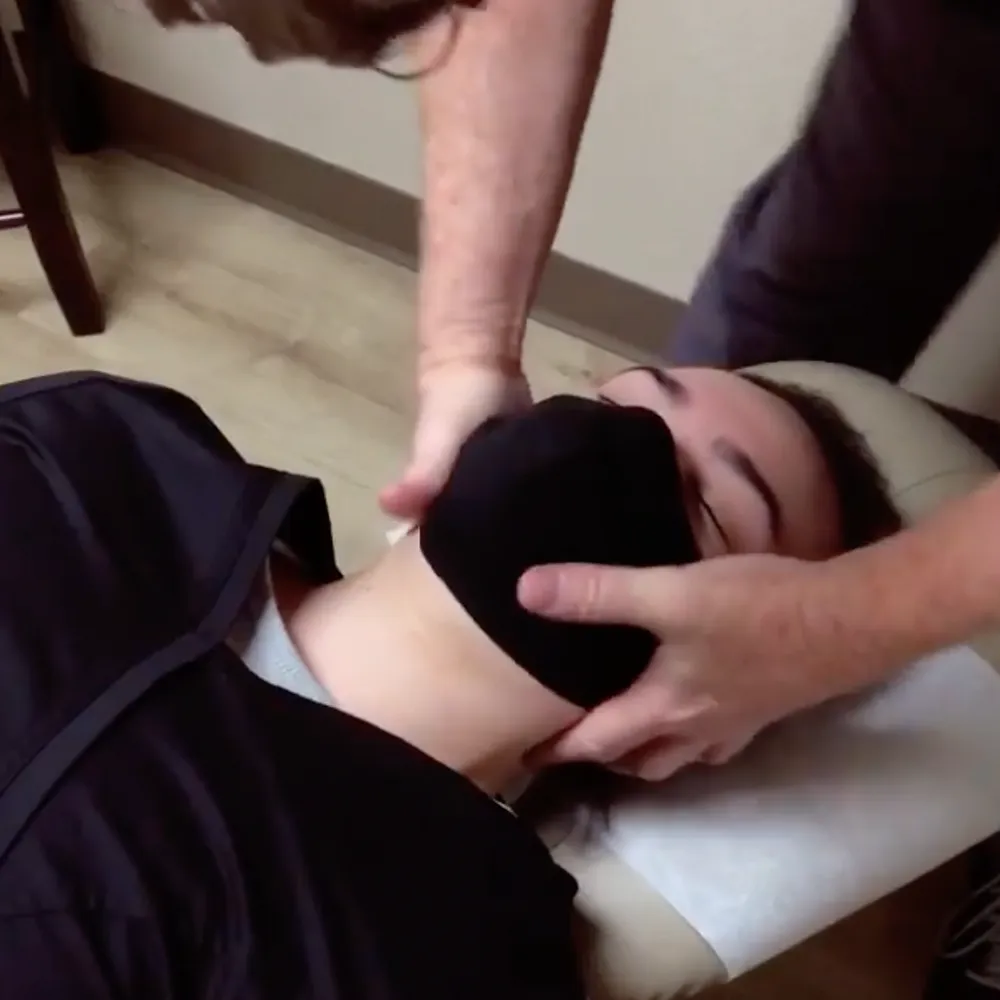 Woman being treated on her neck