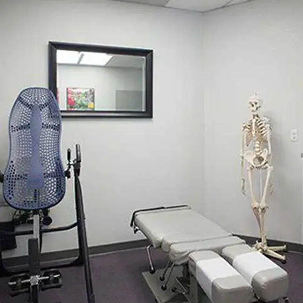 Chiropractic treatment room with skeleton model