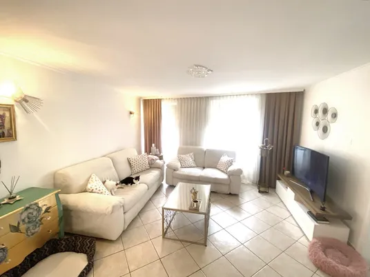 Chiropractor explaining treatment plan with patient chart  