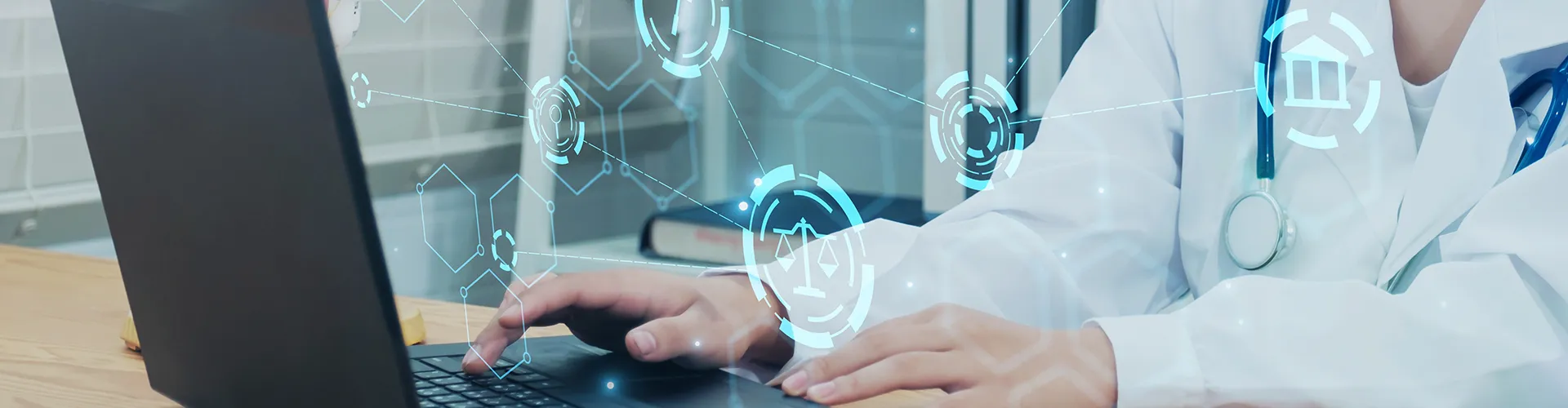 Doctor working on a laptop.