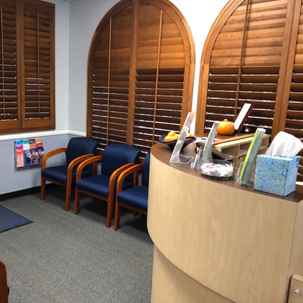 Chiropractic office waiting area with chairs.