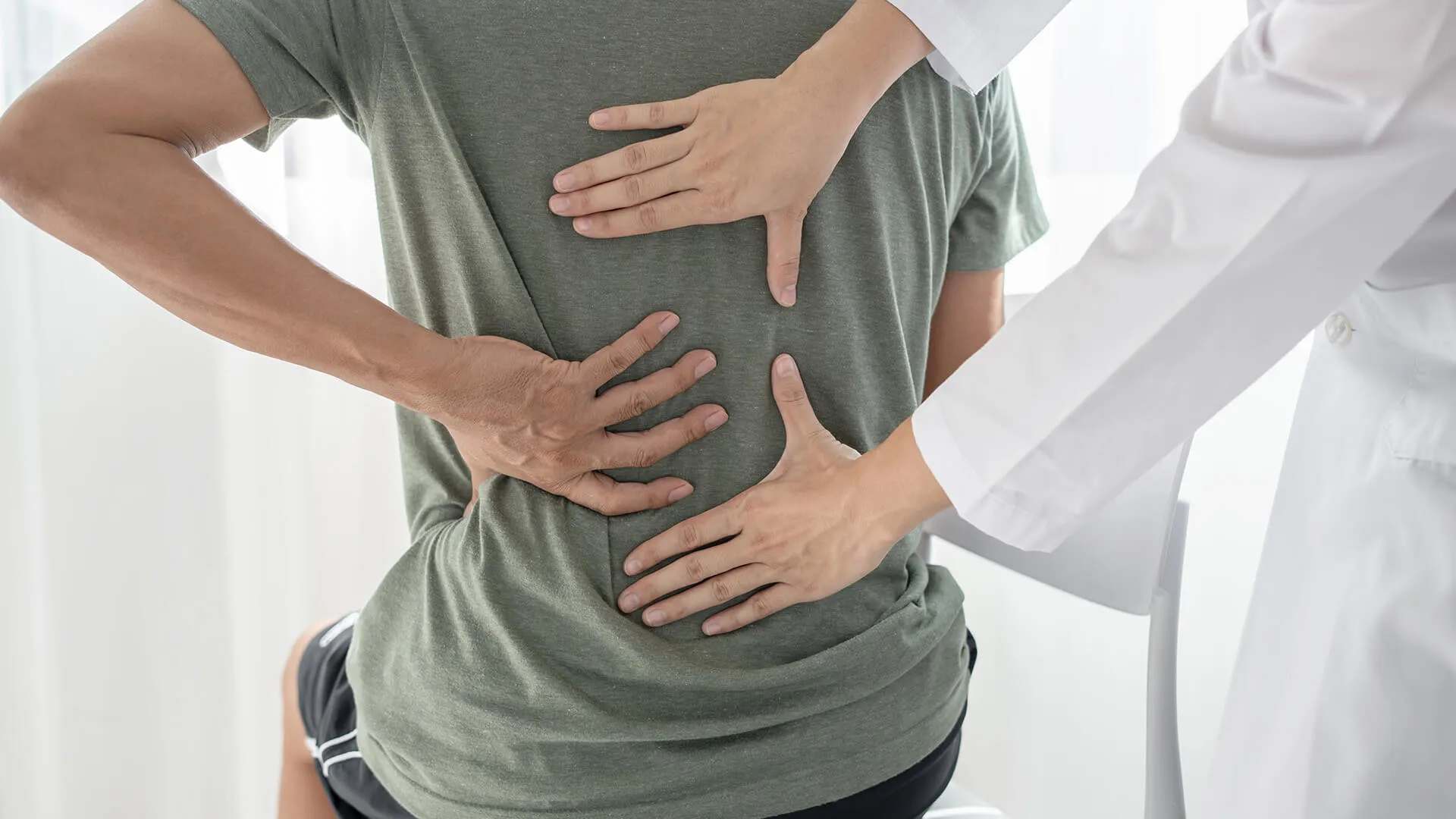 Patient receiving a back examination.