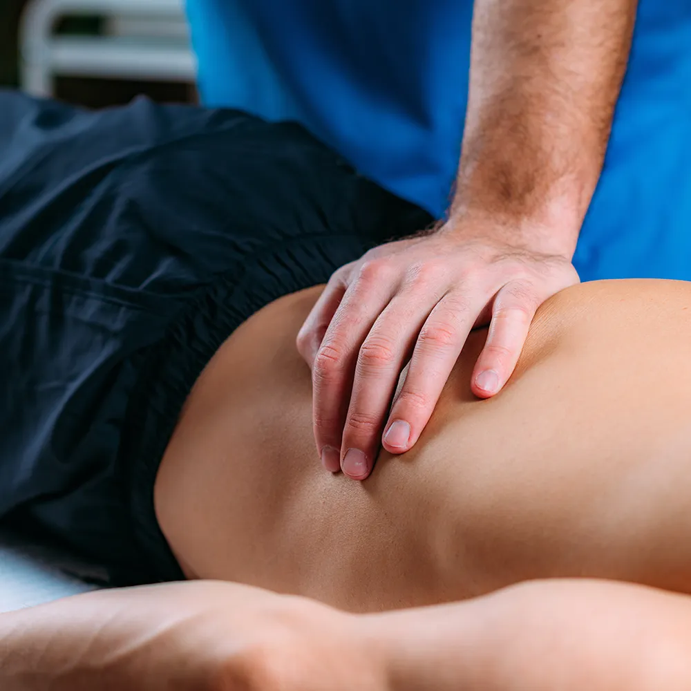 Chiropractor treating a patient for herniated disc injuries.
