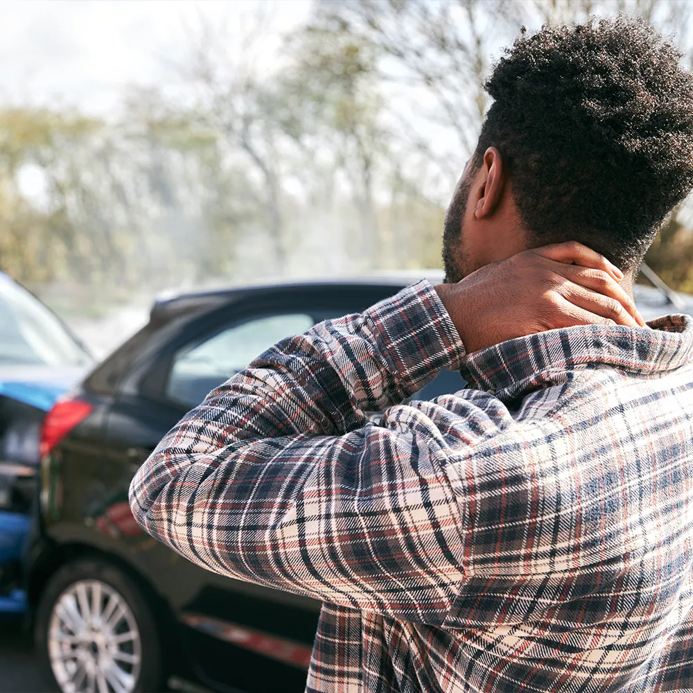 Man with neck pain after a car accident.