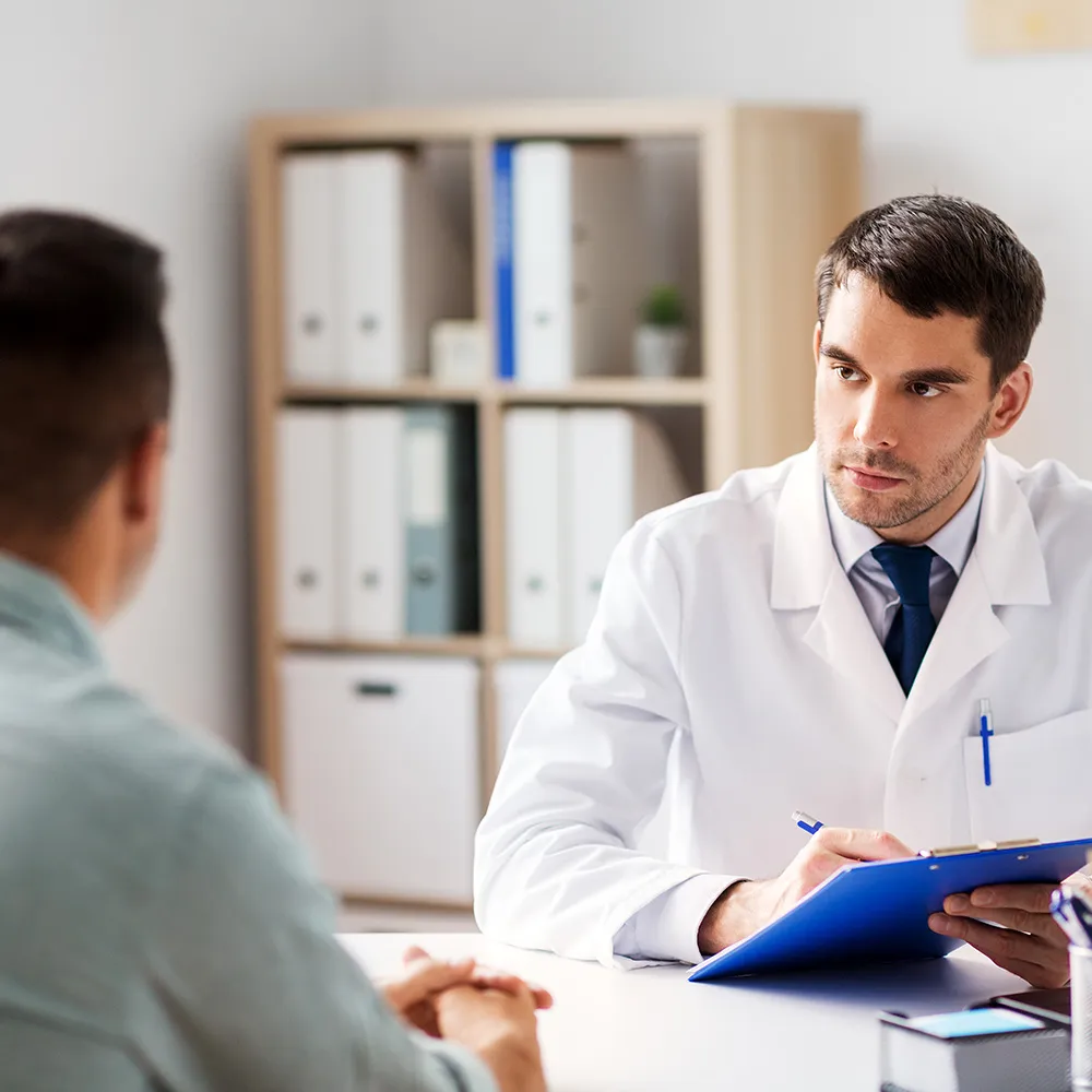 Doctor listening to patient discussion  