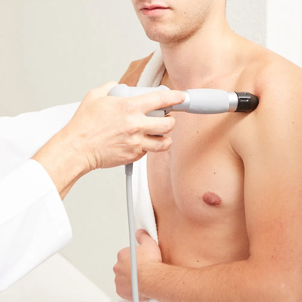 Doctor applying cold laser therapy  