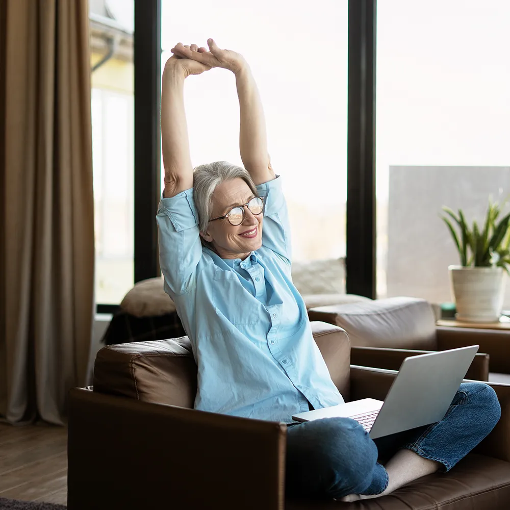 Woman stretching, feeling back pain relief.
