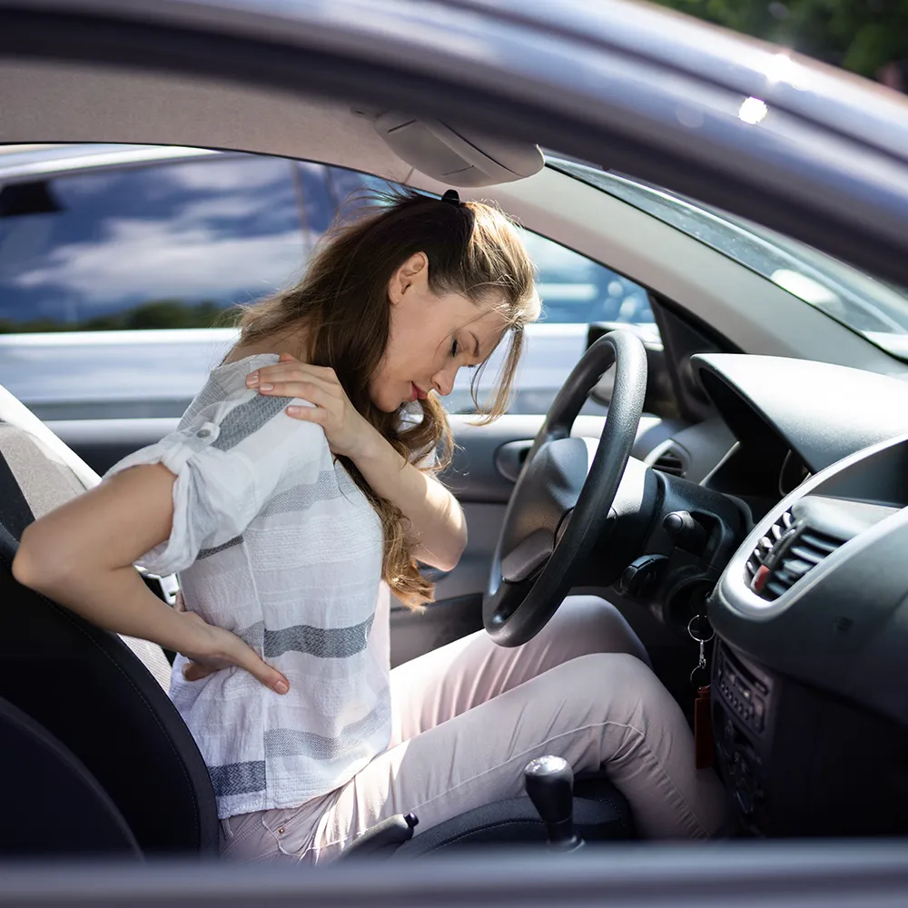 Woman with back and shoulder pain after accident.
