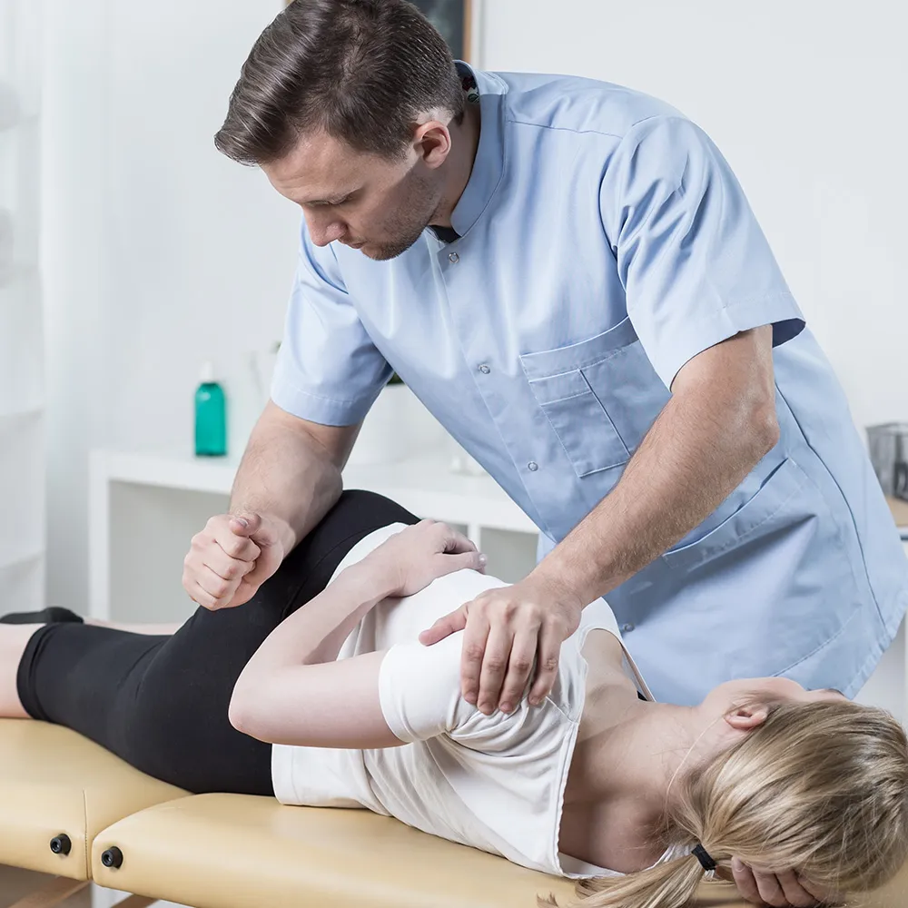 Doctor giving osteopathic treatment