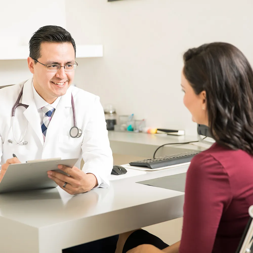 Doctor talking with female patient  