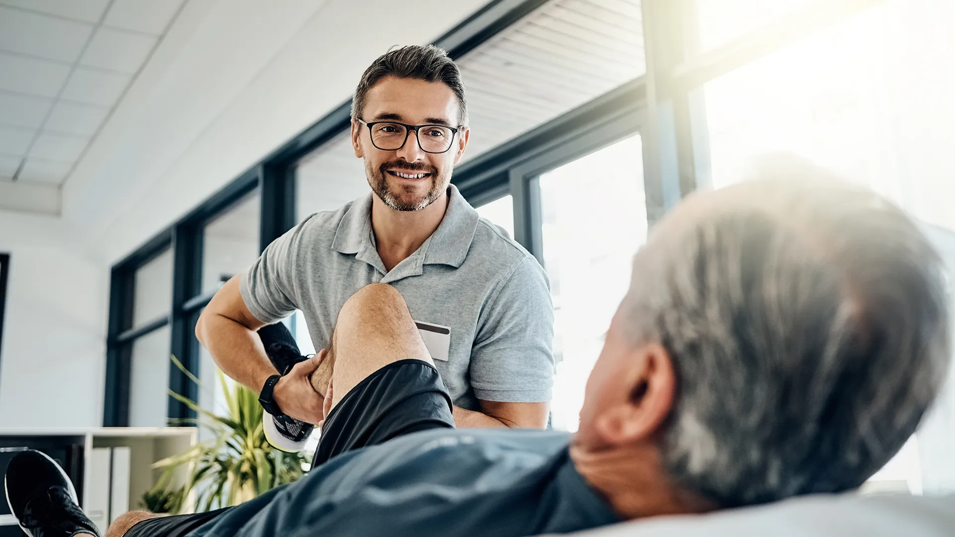 Doctor doing physical therapy to patient