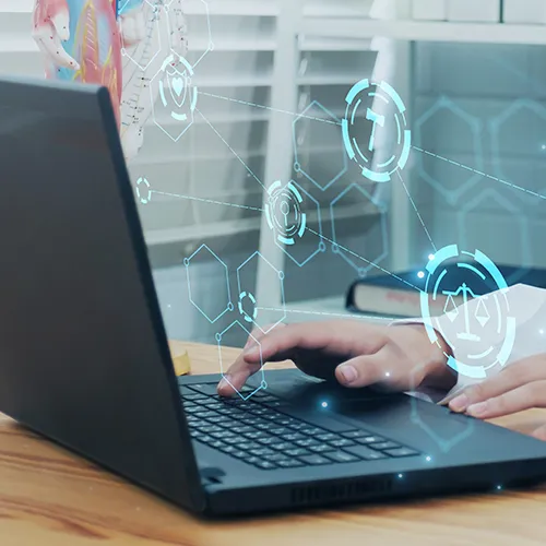 Doctor working on a laptop.