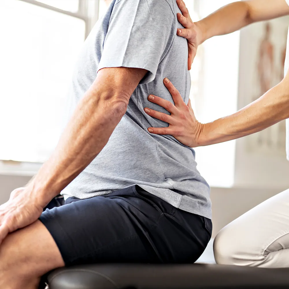 Old men with back pain at the chripartor