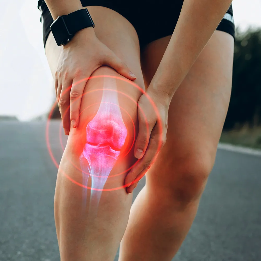 Athlete holding knee in pain  