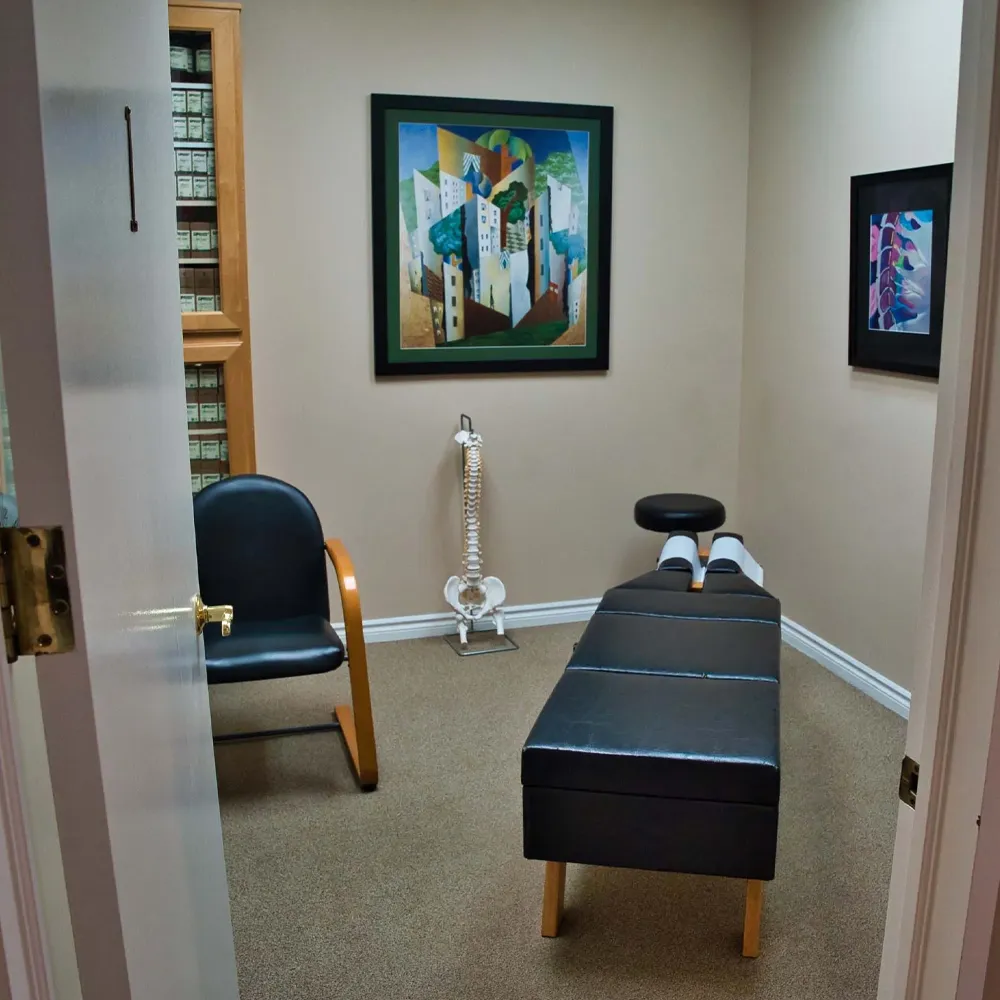 Chiropractic room with spine model and table