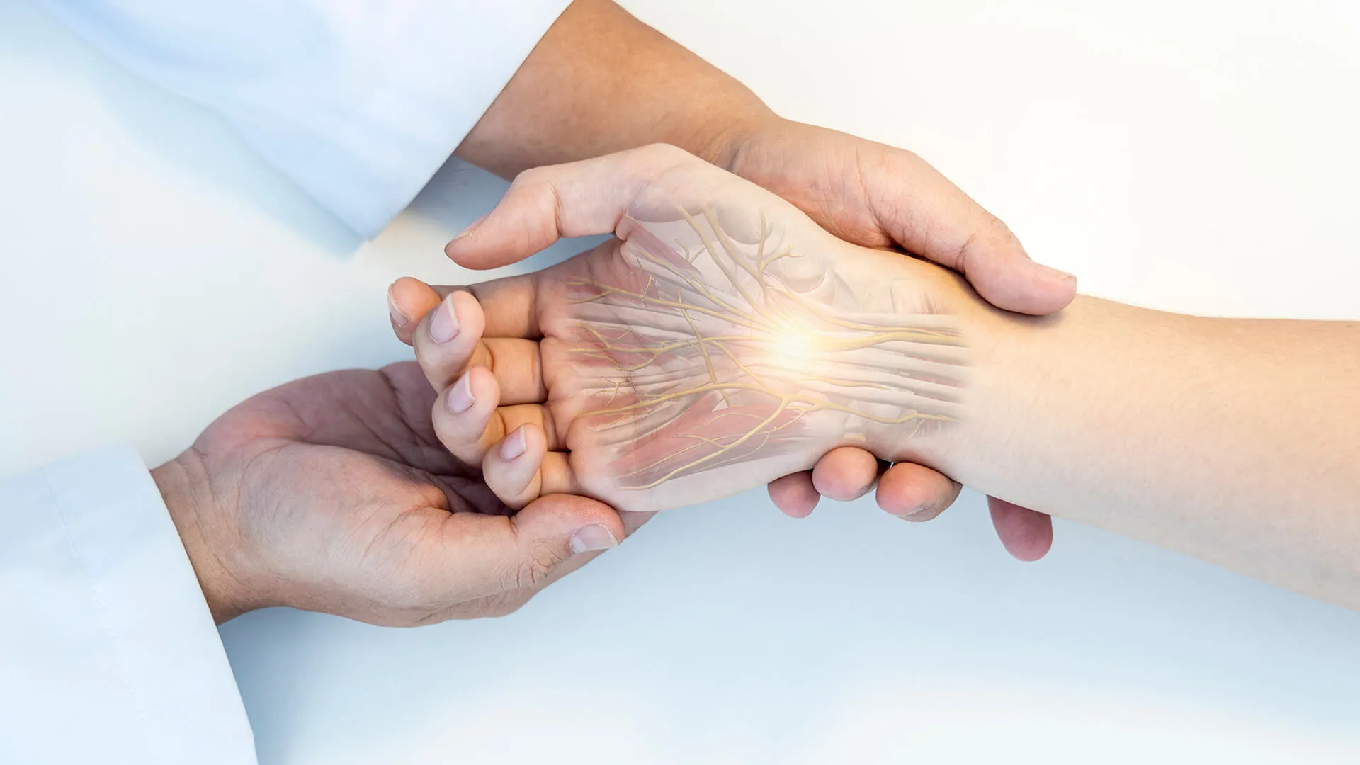 Doctor's hands gripping another hand with nerve pain